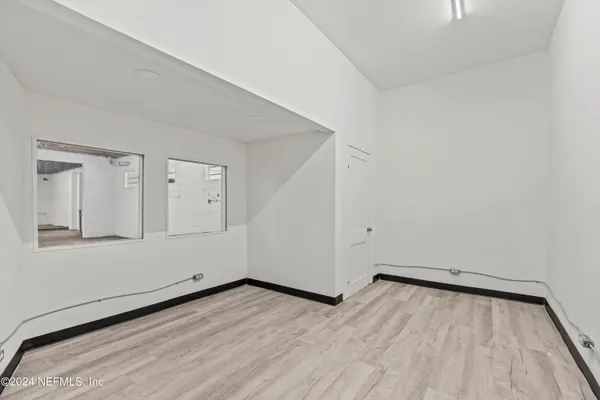 a bathroom with a sink mirror and toilet