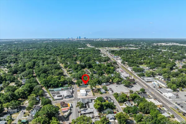 an aerial view of a residential houses with outdoor space