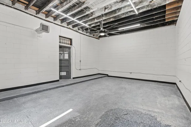 a view of a room with wooden walls