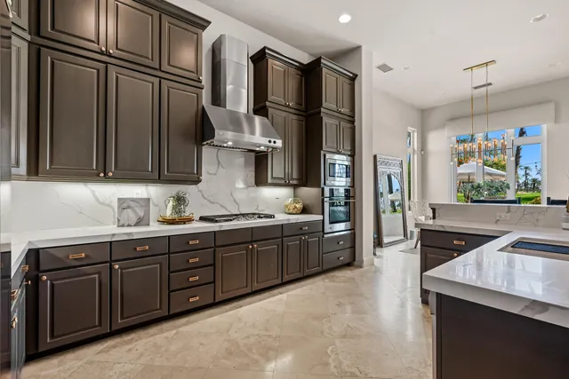 a bedroom with a large bed and a potted plant