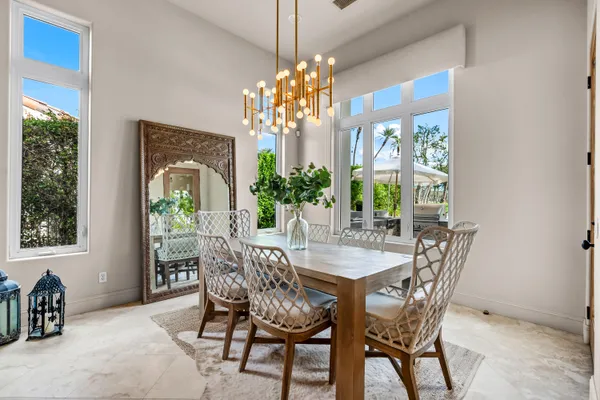 a view of a dining room with furniture and window