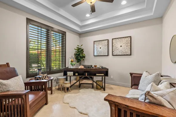 a view of a livingroom with furniture and a potted plant