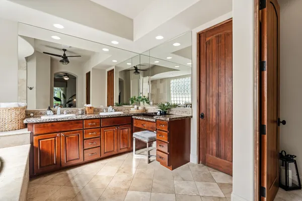a large bathroom with a sink and a mirror