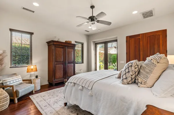 a bedroom with a large bed and a window