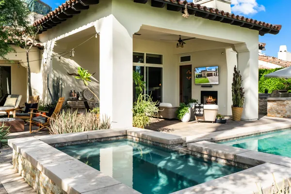 a view of swimming pool with outdoor seating