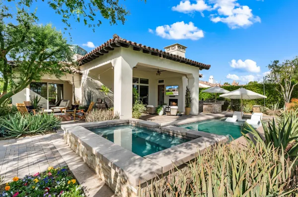 a view of a house with backyard porch and patio