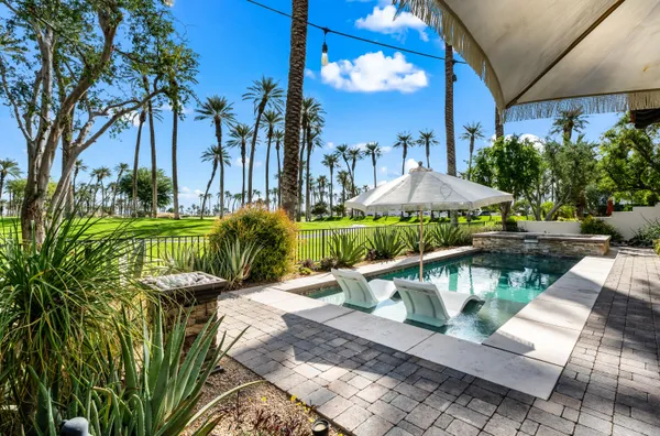 a view of a swimming pool with a patio