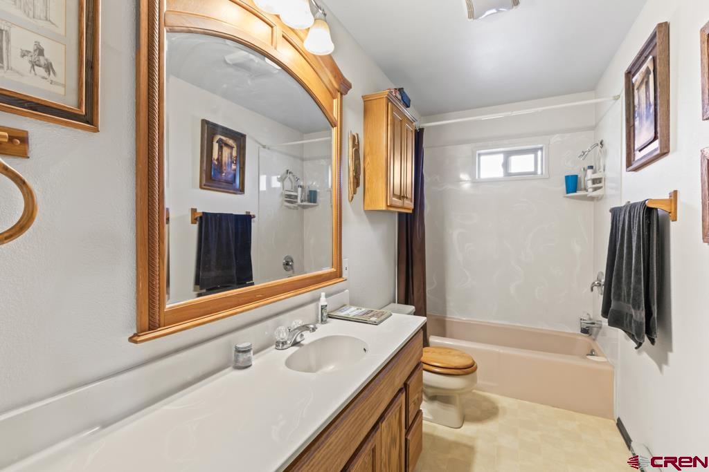 15567 6282nd Road Montrose, CO 81403 - Photo 11 of 36 a bathroom with a sink a toilet and shower