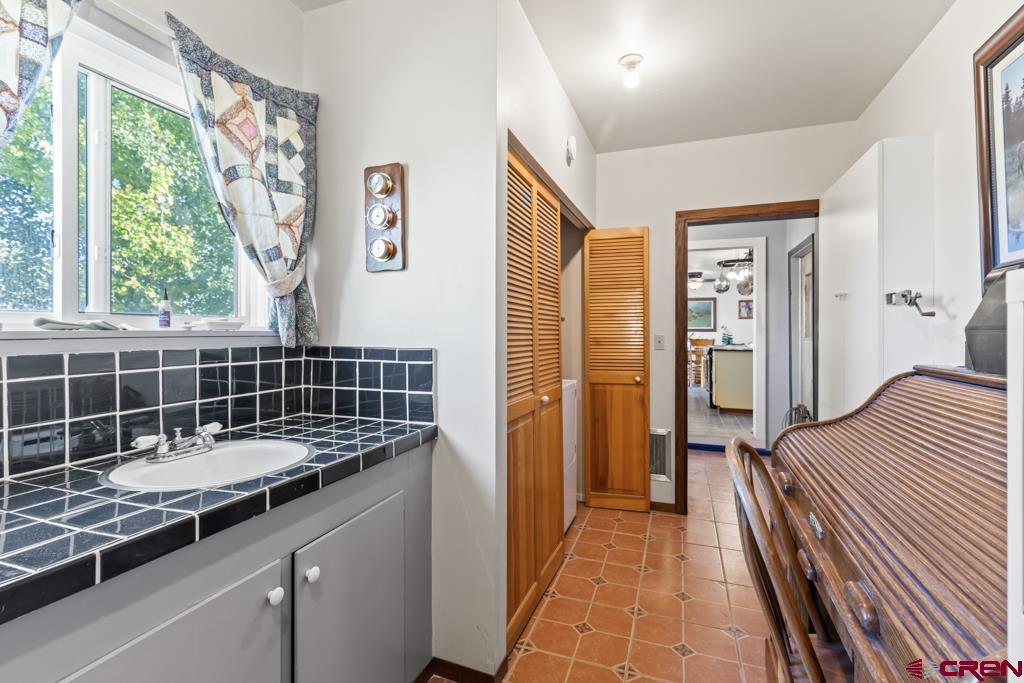 15567 6282nd Road Montrose, CO 81403 - Photo 19 of 36 a bathroom with a sink and a shower