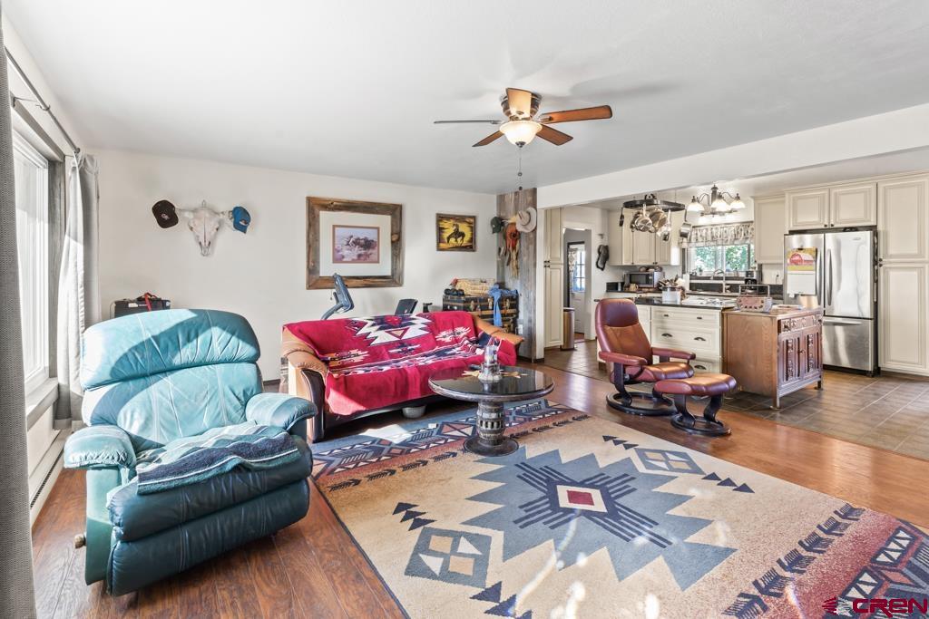 15567 6282nd Road Montrose, CO 81403 - Photo 2 of 36 a living room with furniture and wooden floor