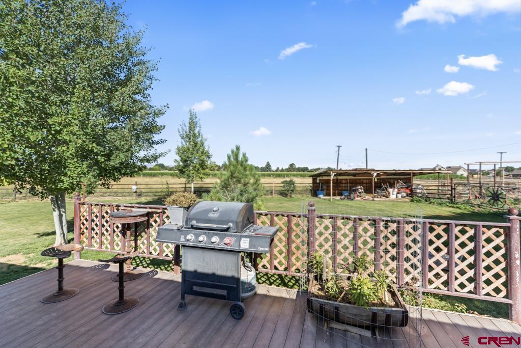 15567 6282nd Road Montrose, CO 81403 - Photo 27 of 36 a view of a chairs and table on the terrace