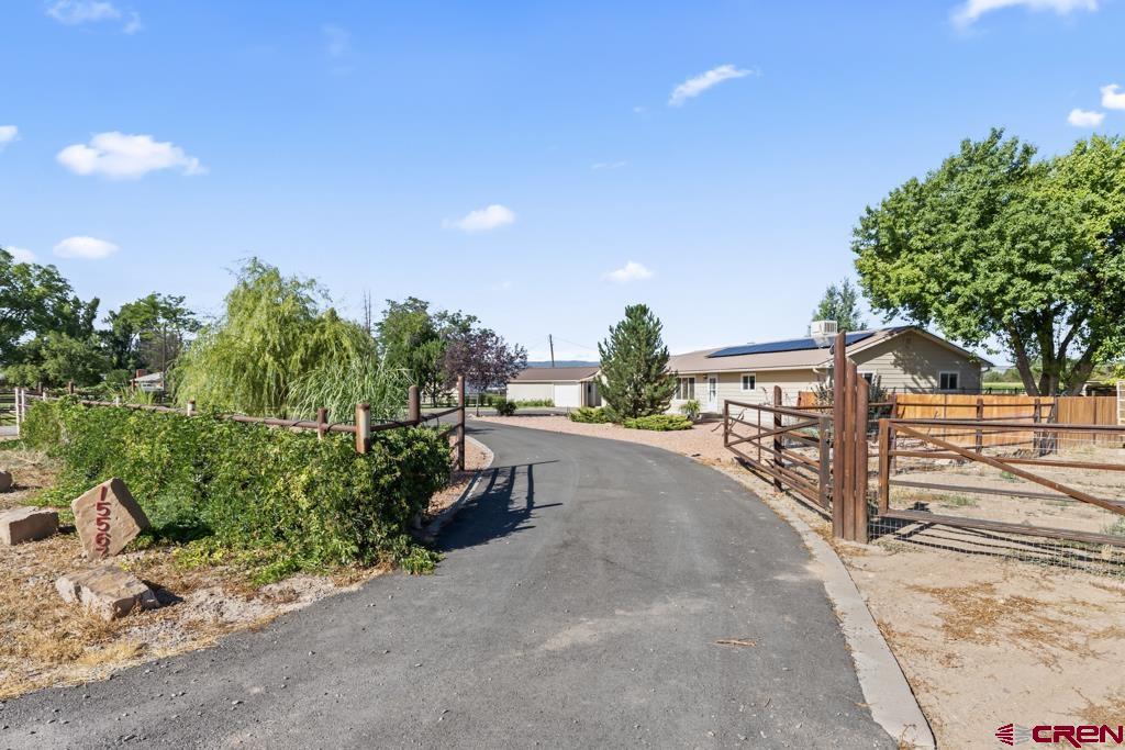 15567 6282nd Road Montrose, CO 81403 - Photo 29 of 36 a view of a pathway with a garden