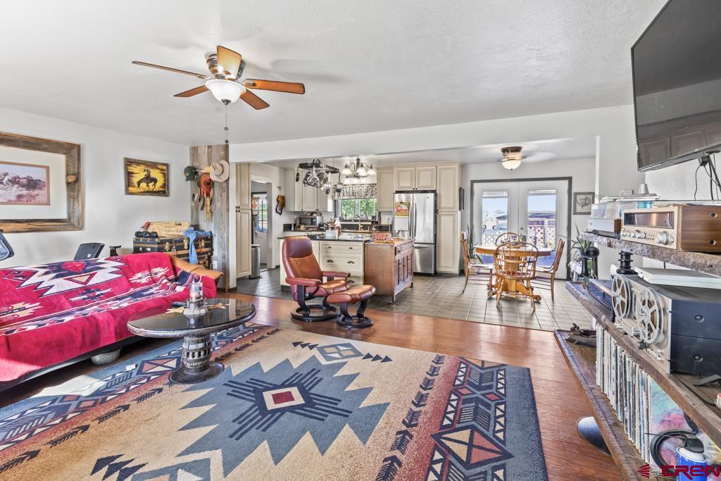 15567 6282nd Road Montrose, CO 81403 - Photo 3 of 36 a living room with lots of furniture and wooden floor