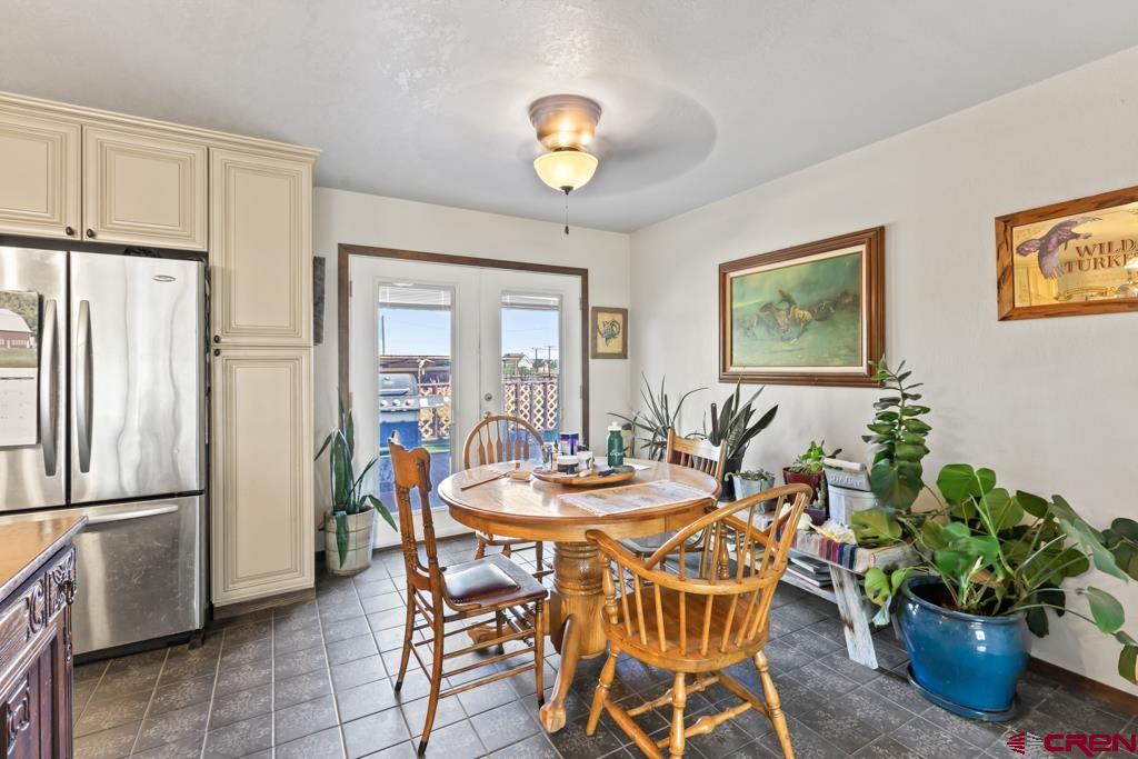 15567 6282nd Road Montrose, CO 81403 - Photo 10 of 36 a dining room with furniture and window