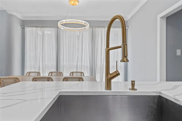 a bathroom with a double vanity sink and a window