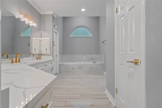 a bathroom with a sink a vanity and a mirror