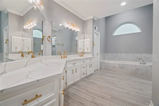 a spacious bathroom with a granite countertop sink a toilet a mirror and shower