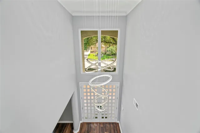 a view of front door with wooden floor