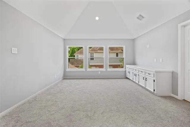 wooden floor in an empty room with windows
