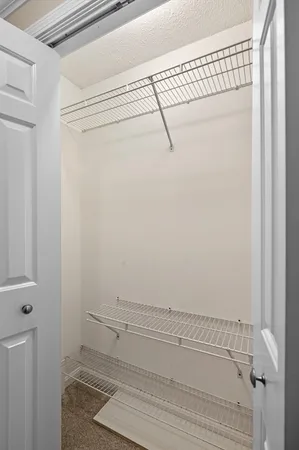 a bathroom with a sink vanity mirror and toilet