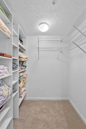 a view of room with window and furniture