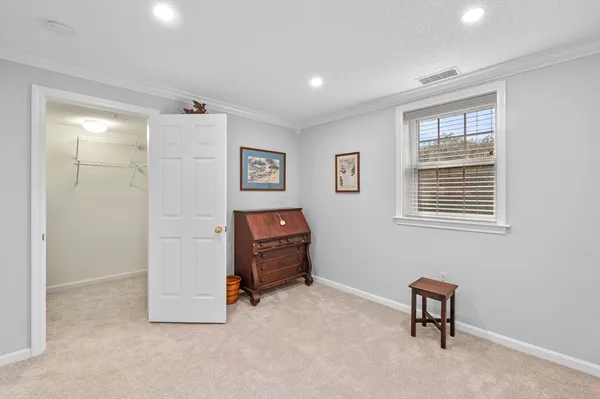 a view of a workspace with furniture and a chair