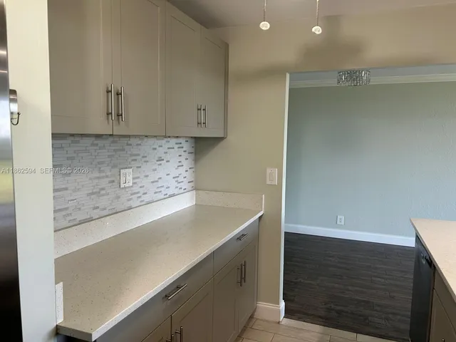 a kitchen with a stove and a microwave