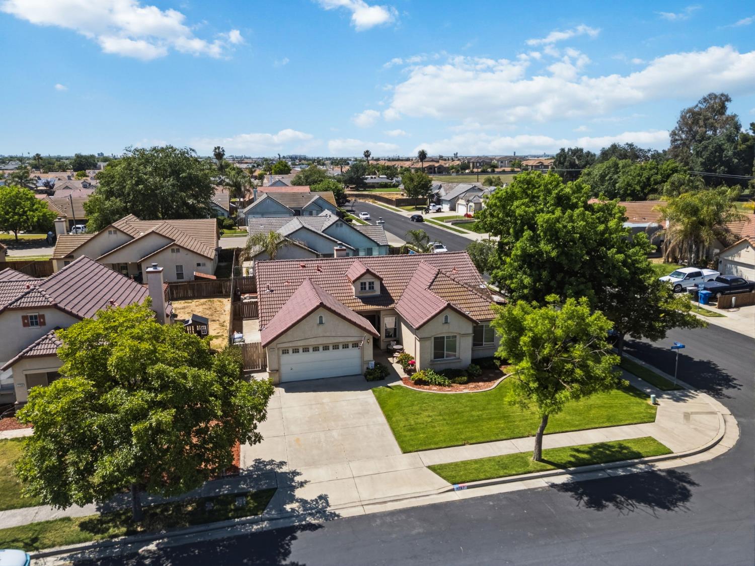 1757 Homestead Way Lemoore, CA 93245 - Photo 33 of 35 an aerial view of a house with a garden