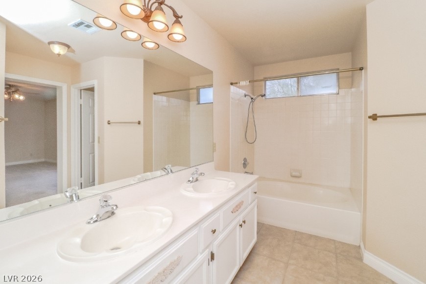1429 Hawkwood Road Henderson, NV 89014 - Photo 26 of 53 A spacious double vanity and a built-in soaking tub define this bathroom.
