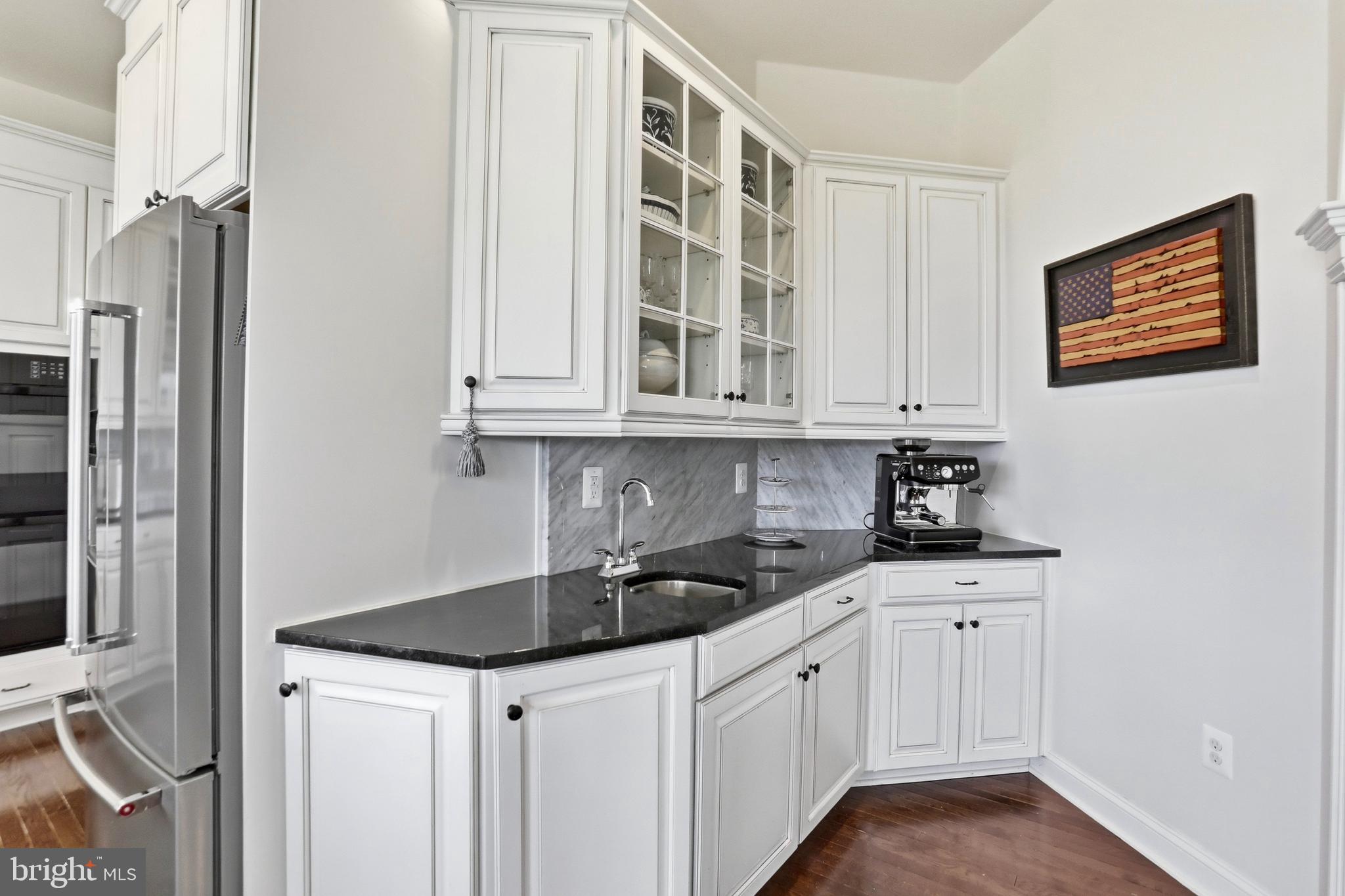 36972 Bridle Ridge Lane Purcellville, VA 20132 - Photo 12 of 44 a kitchen with stainless steel appliances granite countertop a sink and a granite counter tops