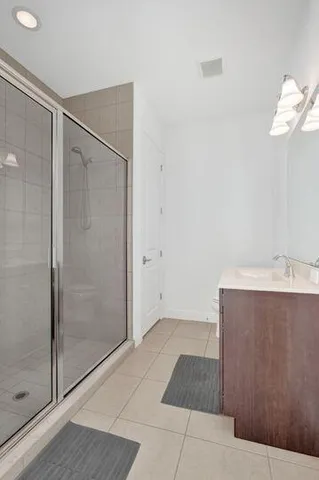 a bathroom with a shower and a sink