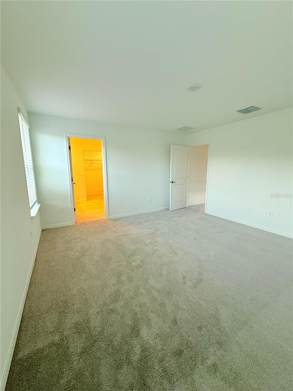 17602 Pleasantview Boulevard Land O Lakes, FL 34638 - Photo 16 of 27 an empty room with a ocean view