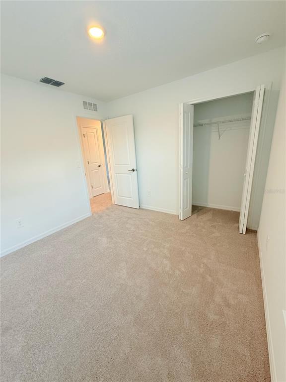 17602 Pleasantview Boulevard Land O Lakes, FL 34638 - Photo 21 of 27 a view of an empty room