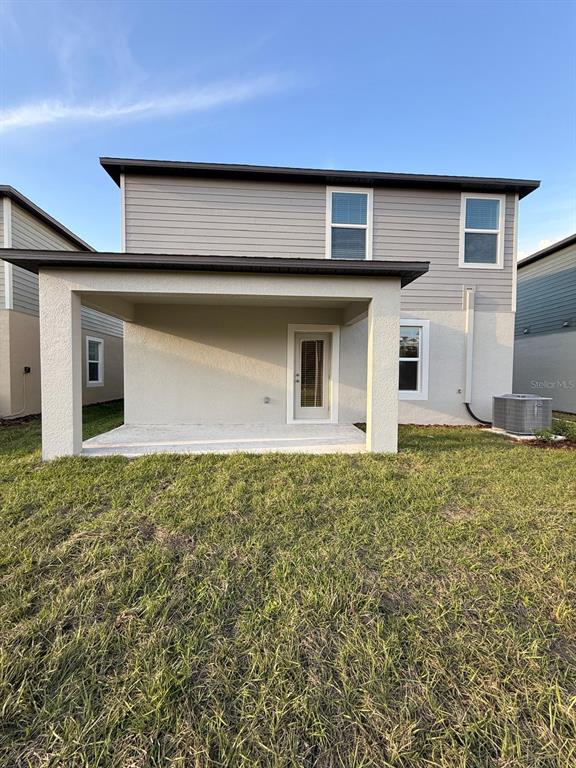 17602 Pleasantview Boulevard Land O Lakes, FL 34638 - Photo 26 of 27 a house with yard