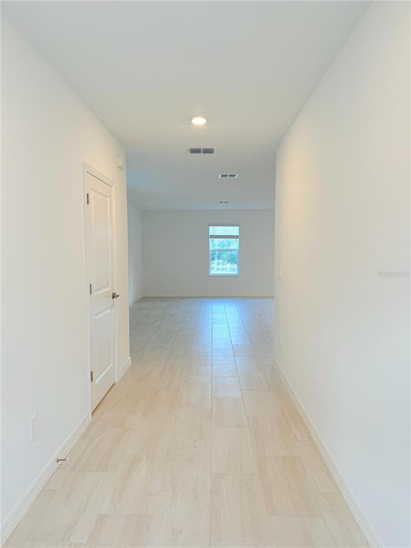 17602 Pleasantview Boulevard Land O Lakes, FL 34638 - Photo 3 of 27 an empty room with windows