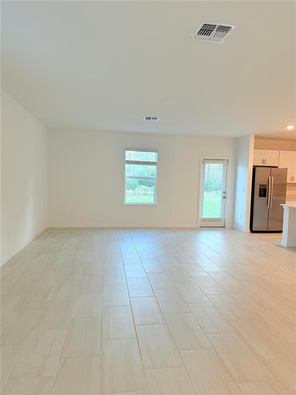 17602 Pleasantview Boulevard Land O Lakes, FL 34638 - Photo 4 of 27 a view of an empty room with a window