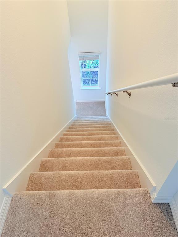 17602 Pleasantview Boulevard Land O Lakes, FL 34638 - Photo 9 of 27 a view of entryway with wooden floor