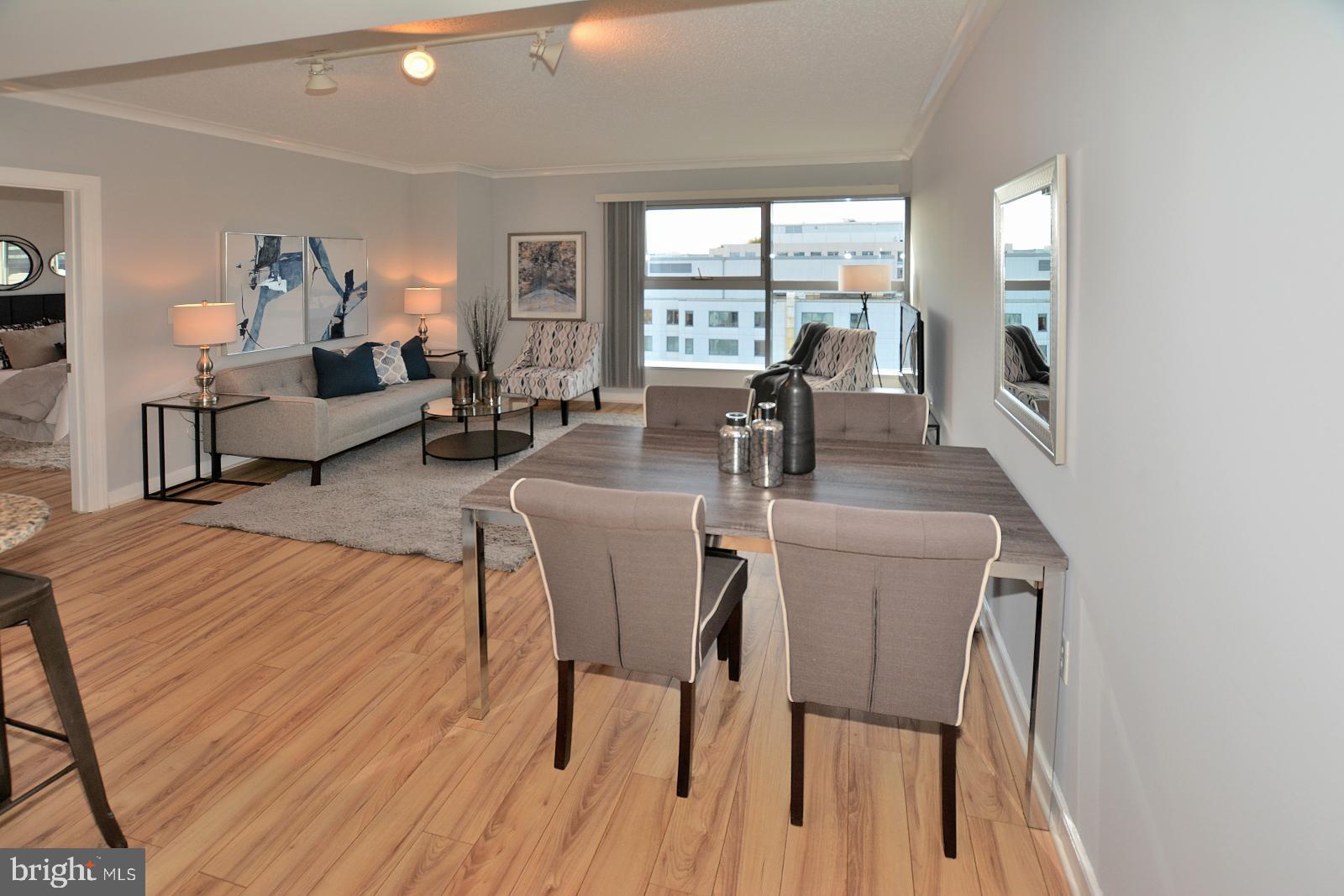 777 7th Street Northwest, Unit 1014 Washington, DC 20001 - Photo 14 of 43 a living room with furniture and a table