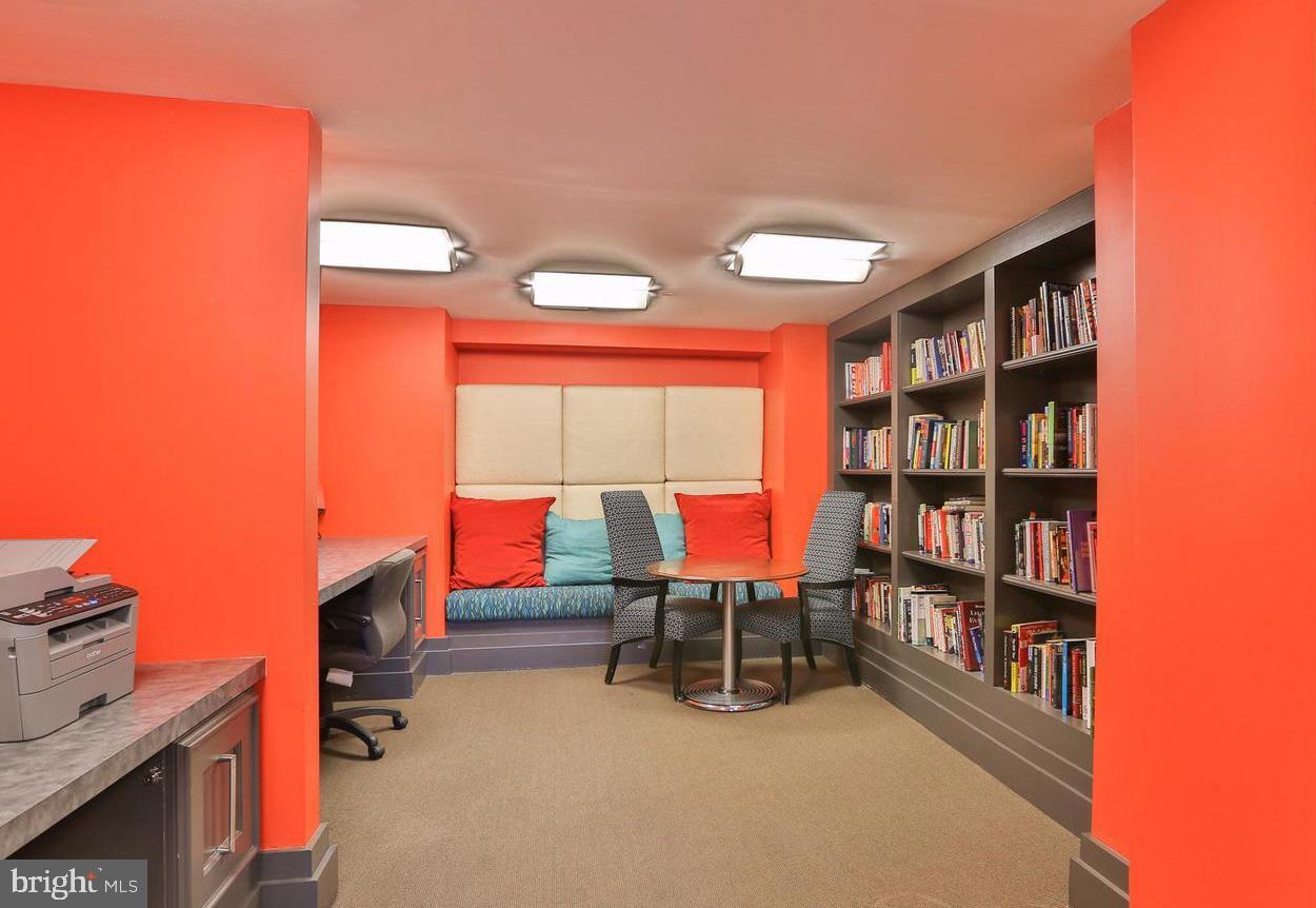 777 7th Street Northwest, Unit 1014 Washington, DC 20001 - Photo 34 of 43 a room with furniture and a book shelf
