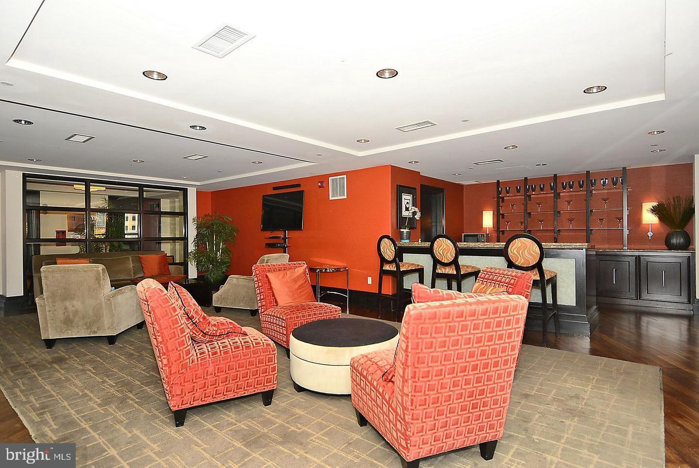 777 7th Street Northwest, Unit 1014 Washington, DC 20001 - Photo 35 of 43 a living room with patio furniture and a large window