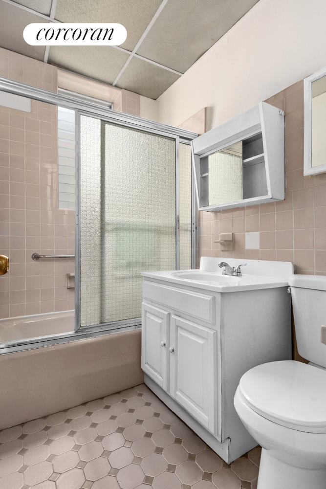 845 Bay Ridge Avenue Brooklyn, NY 11220 - Photo 6 of 7 a bathroom with a granite countertop sink toilet and shower