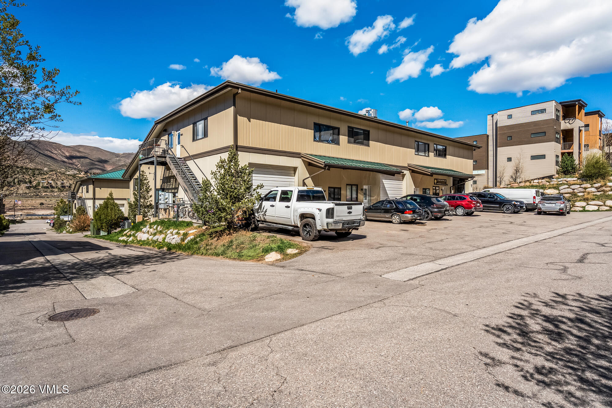 a view of a street with cars