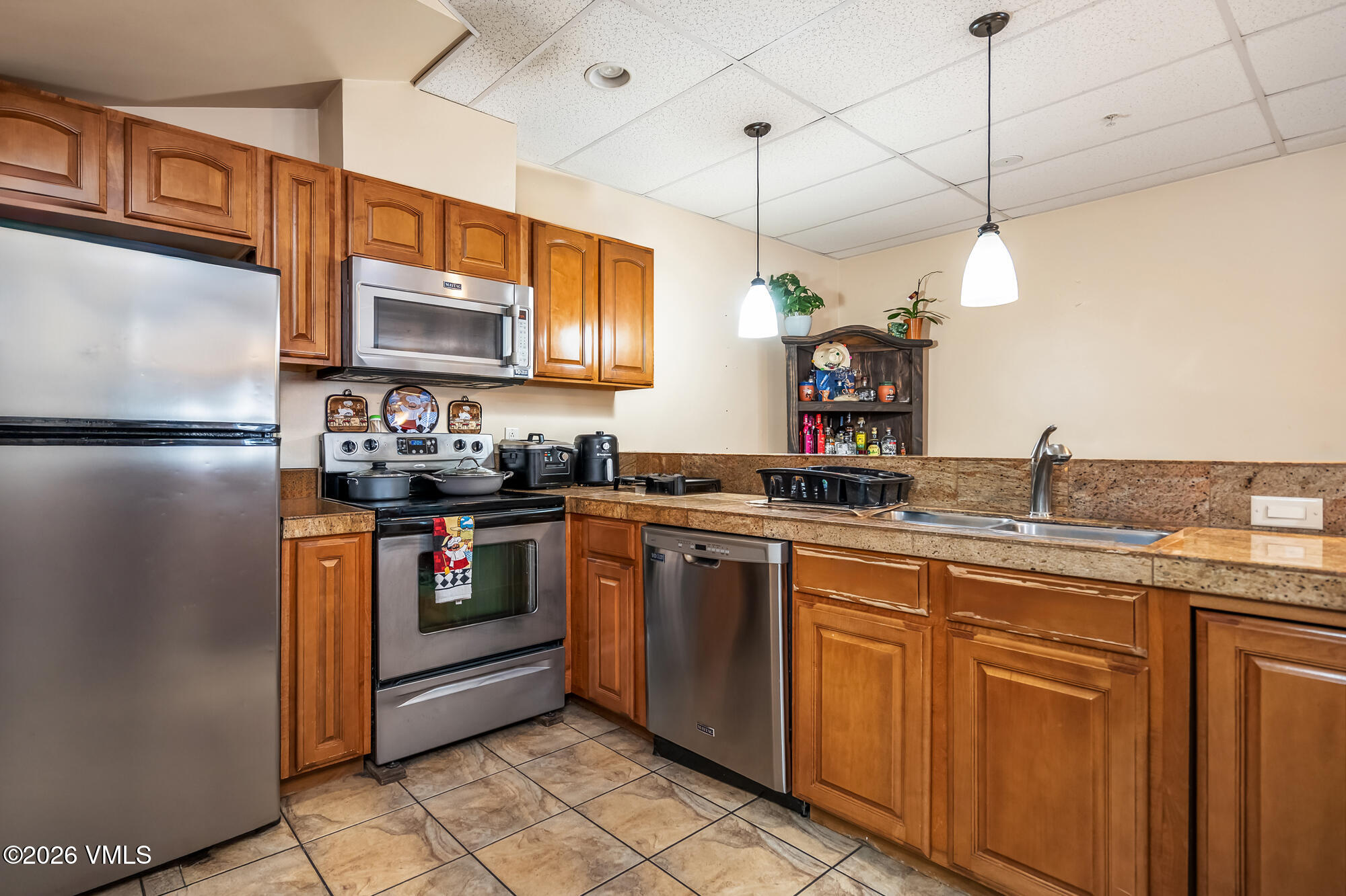 5 Murray Road, Unit B4 Edwards, CO 81632 - Photo 15 of 28 a kitchen with a sink and refrigerator