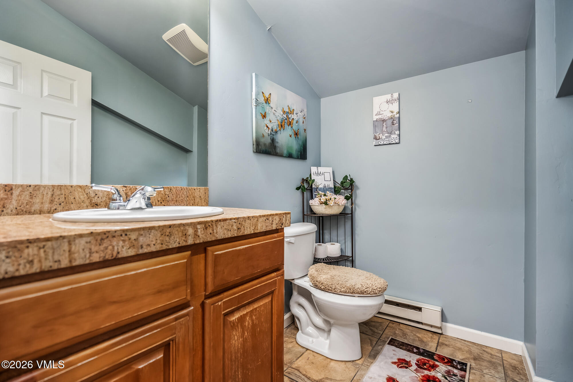 5 Murray Road, Unit B4 Edwards, CO 81632 - Photo 23 of 28 a bathroom with a granite countertop toilet sink and mirror