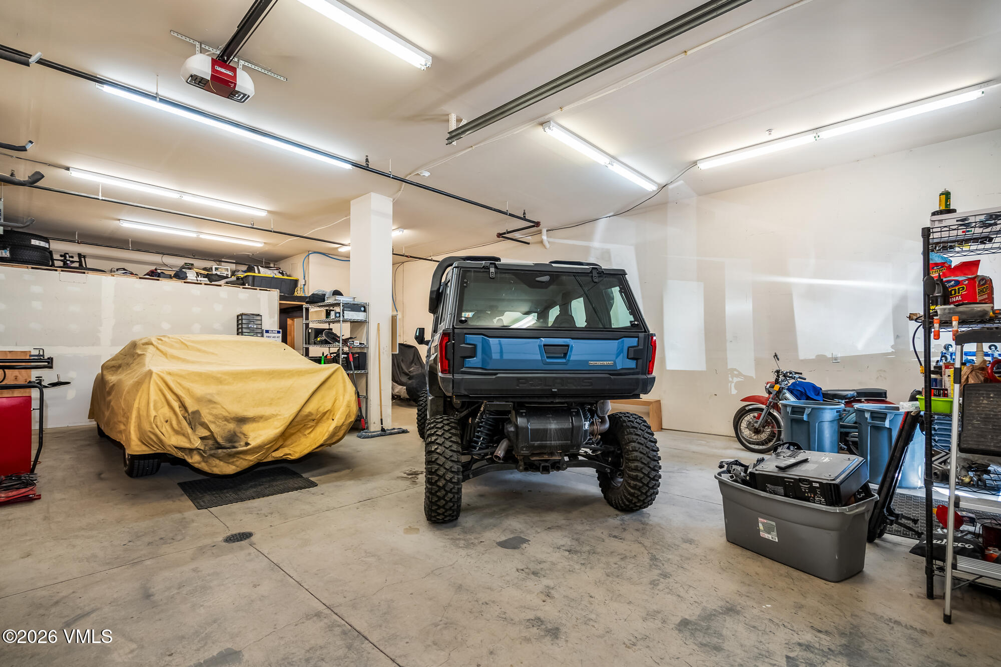 5 Murray Road, Unit B4 Edwards, CO 81632 - Photo 5 of 28 a car and bike parked in a garage