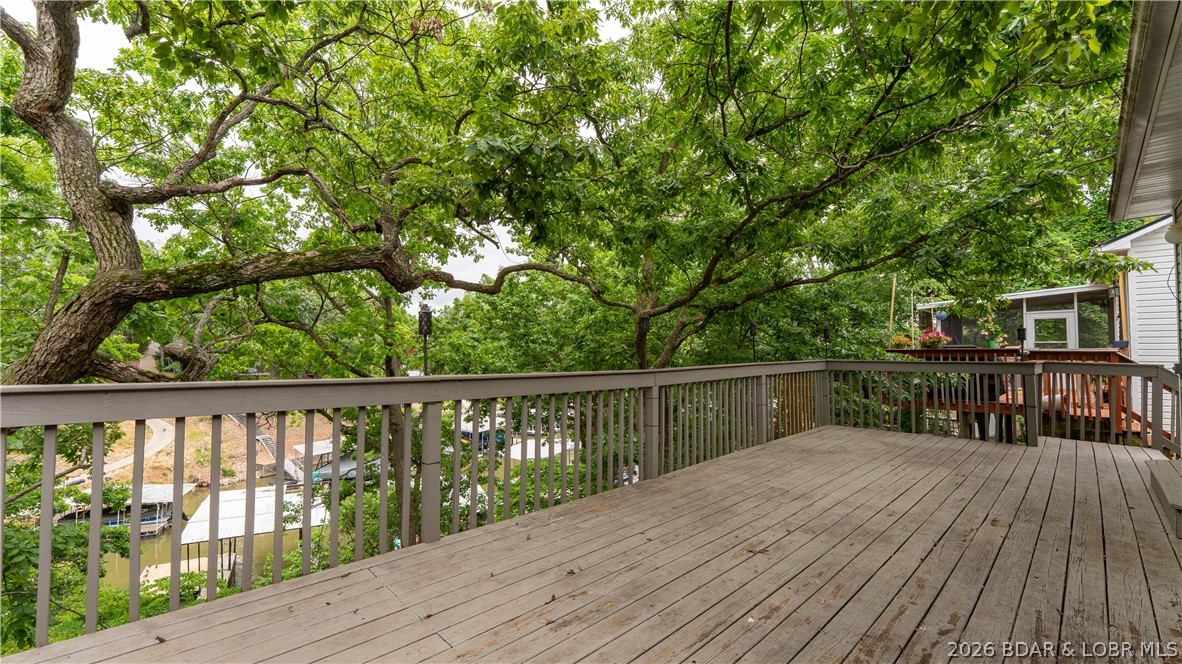 57 Arrowhead Beach Road Lake Ozark, MO 65049 - Photo 17 of 32 Spacious deck on lakeside of home
