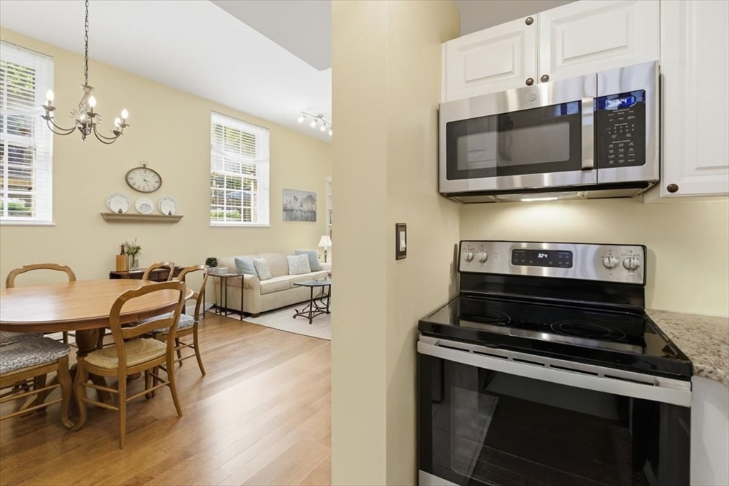 65 Glen Road, Unit H1 Brookline, MA 02445 - Photo 16 of 39 a kitchen with a stove and a microwave