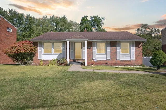 front view of a house with a yard