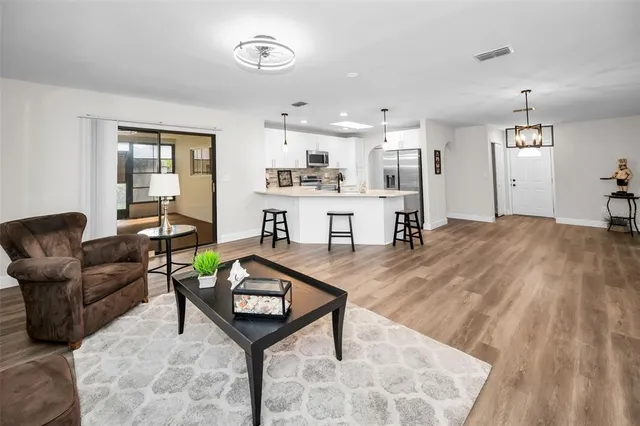 a living room with furniture and a table