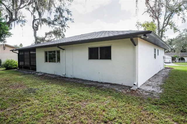a house with trees in the background